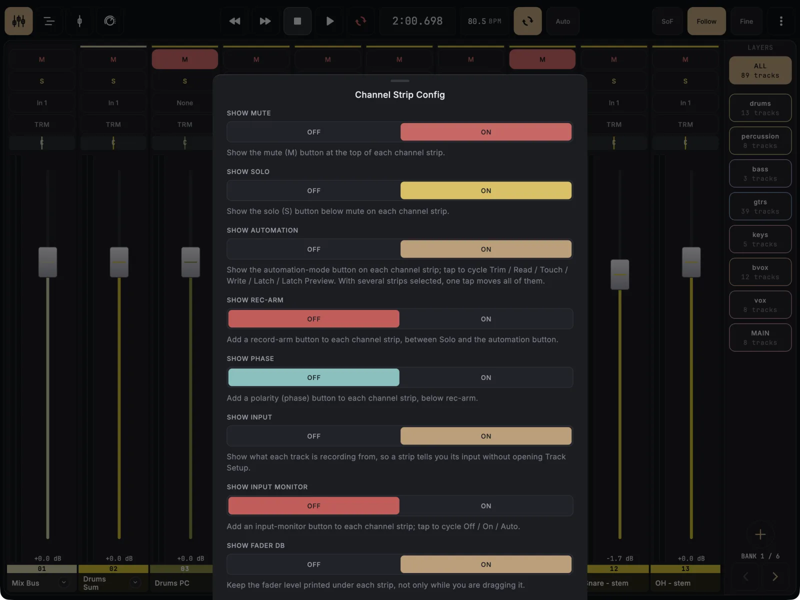 Mixer strip layout sheet over the mixer with Show Input set to On; the strips behind it now show their inputs such as In 1 and None